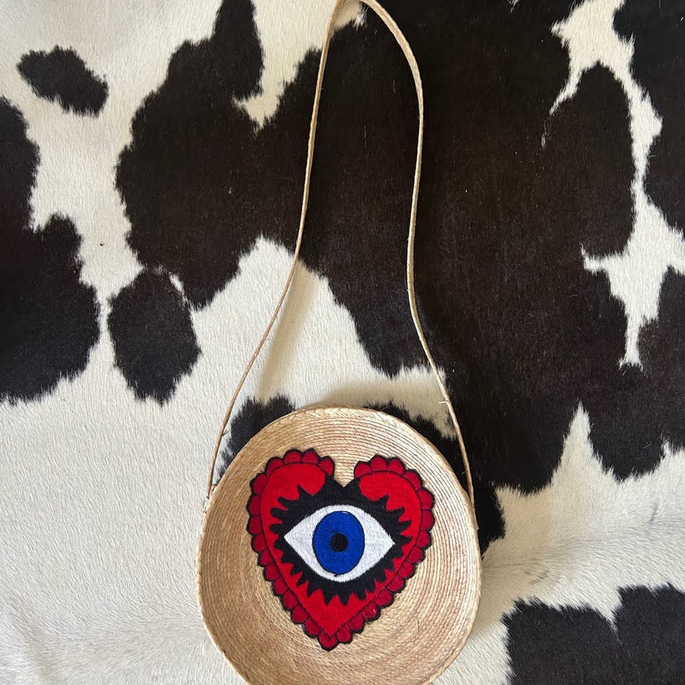 Handcrafted Tan Bag with Red and Blue Eye Design